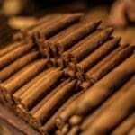 A close up of some cigars on top of each other
