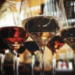 A group of wine glasses sitting on top of each other.