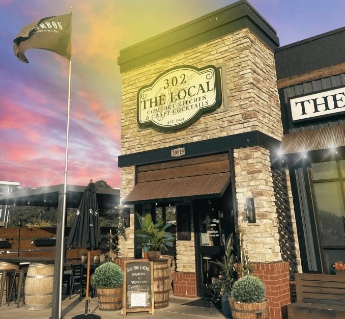 A restaurant with a large sign on the front of it.