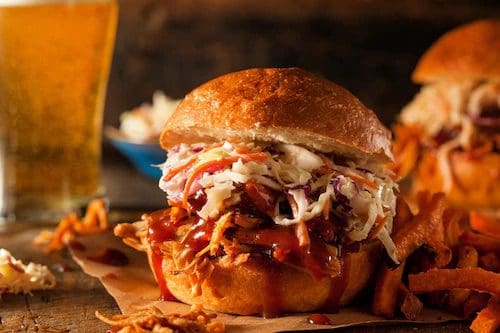 A close up of a sandwich on top of paper